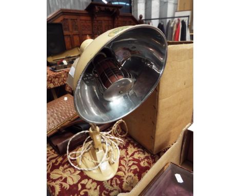 A vintage cream painted Ergon heat lamp