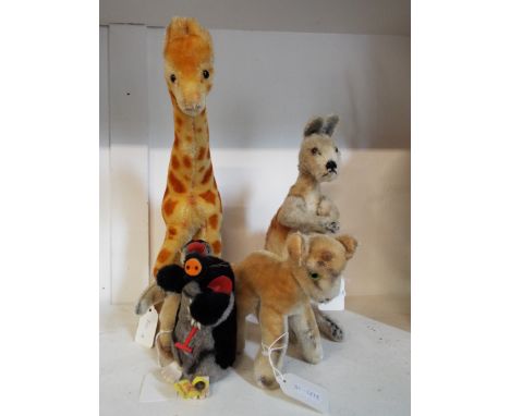 A Steiff mohair mole with button and tag together with possibly a Steiff Kangaroo, Giraffe, Fawn and Penguin 