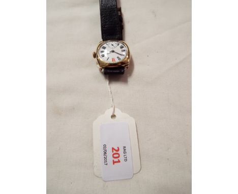 A 9ct gold wristwatch with enamel dial, Roman numerals and subsidiary dial, and a leather strap (needs attention)