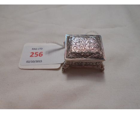 A 925 miniature silver cased musical box having engraved scroll decoration resting on ball feet  Working but one comb tang mi