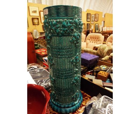 A Burmantofts turquoise stick stand with floral decoration 