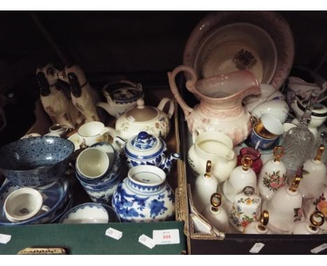 Two boxes of assorted ceramics and glass to include porcelain bells, a pair of Staffordshire style Spaniels, modern Oriental 