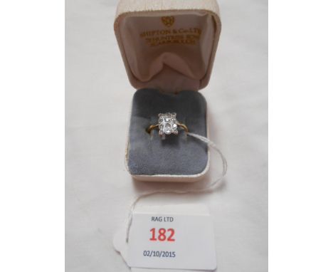 An 18ct gold art deco ring set with twelve diamonds, size M