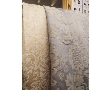 Two pairs of cream and white floral curtains together with a pair of blue and white floral decorated curtains