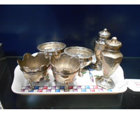 A pair of Sheffield silver peppers, a pair of silver salts dated Sheffield 1913 - 1914 plus a pair of Hunt & Roskell Ltd silv