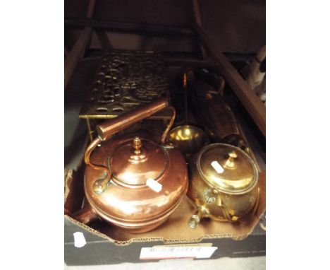 A selection of miscellaneous copper and brass-ware to include a Victorian trivet, copper kettle, chestnut roaster, ladle etc 