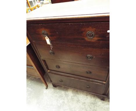 A 20th C oak chest of four long graduated drawers each with brass drop ring handles