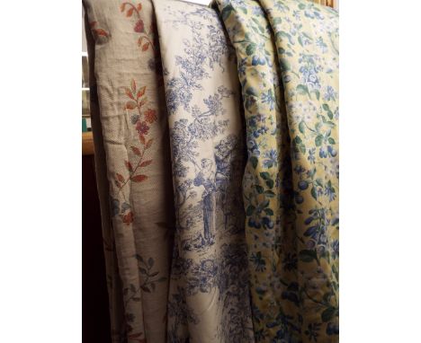 A pair of floral embossed curtains, a pair of yellow floral curtains and matching bed spread plus a pair of blue and white cu