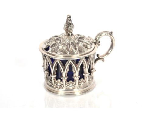 A William IV silver mustard pot, by Henry Wilkinson &amp; Company, the domed lid having raised foliate decoration and leaf fi