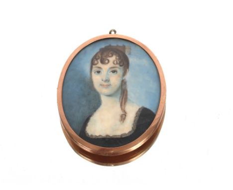 19th century school small oval portrait study of a young girl, her hair in ringlets, contained in yellow metal frame with hai