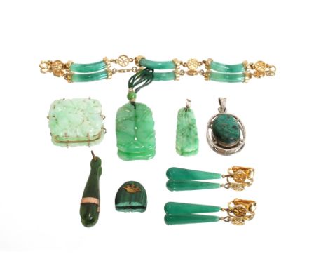 A 9ct gold mounted and carved Jade brooch, 11.5gms measuring 3.8 by 3cm; a carved Jade pendant, 14gms, 4cm x 2.5cm; a carved 