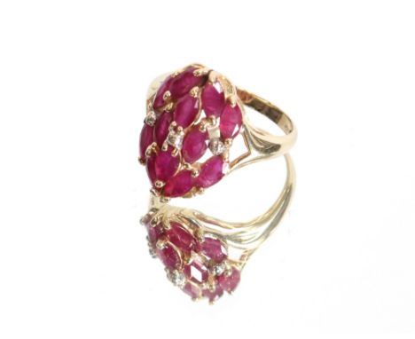 A yellow metal ring, marked 14k, set with red and white stones, approximately 4.5gms, ring size P