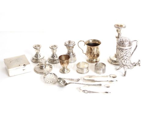 A small baluster silver christening mug, Birmingham 1920; a small silver egg cup; a small silver capstan shaped inkwell AF; t