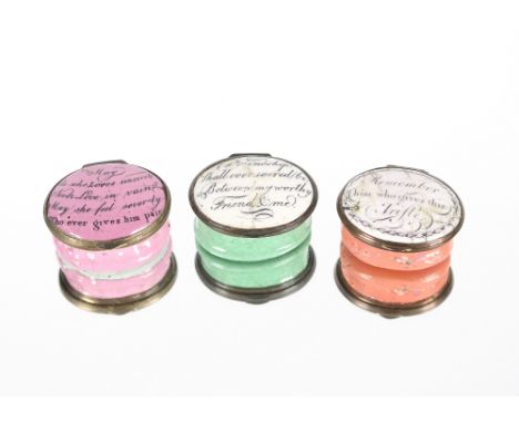 An 18th century enamel hinged patch box, the lid with romantic inscription; another similar example and another, the lid insc