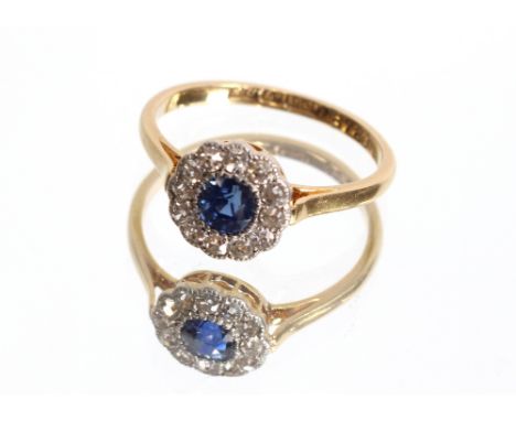 An 18ct gold sapphire and diamond ring, set central sapphire, approximately 0.20ct surrounded by diamonds, 2gms, ring size N