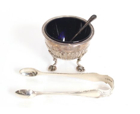 A Georgian silver sugar bowl with fluted decoration raised on three pad feet complete with blue glass liner, marks indistinct