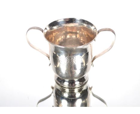 A George III silver twin handled cup by Joseph Lock, flanked by reeded scroll handle and raised on a circular spread foot.  L