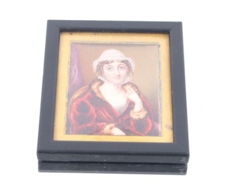 An early 19th Century miniature portrait of Anne Jane Clerk, wearing lace bonnet and ermine trimmed cloak, inscription verso