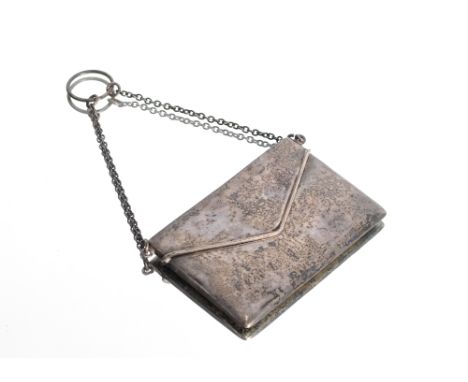 An Edwardian silver envelope shaped card case hallmarked for Chester 1909 hung to a fine link chain