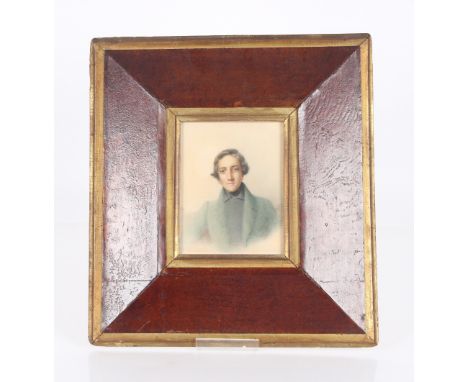 Early 19th century school, a pair of head and shoulder portrait studies of young gentleman contained in oak and gilt mounted 