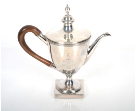 A George III silver coffee pot by Charles Asprey.  The lid surmounted by a bar shaped finial with wooden handle.  The body wi