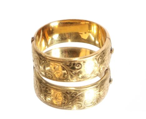 A 9ct gold and metal core snap bangle, marked L &amp; Co, 43gms total weight
