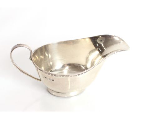 A George III silver sauce boat with gadroon border, raised on oval foot,  Sheffield 1937, 4.5oz
