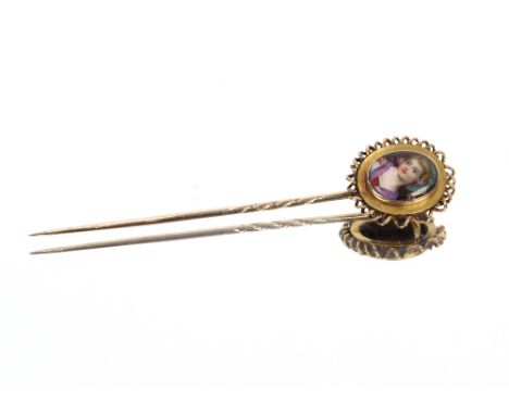 A yellow metal stick pin with oval portrait panel, 3gms, 6.5cm