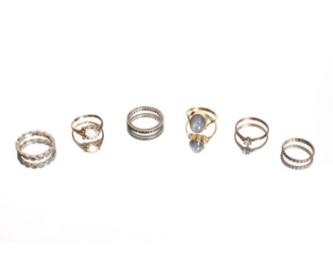 A gold ring, marks rubbed, set with moonstone type stone, 4gms, ringsize M; a 9ct gold white stone set ring AF, 2gms ring siz