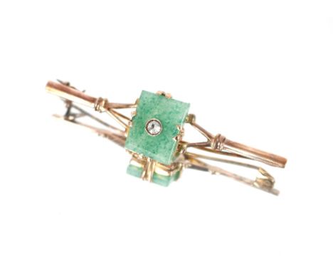 A yellow metal brooch marked 9K having central jade coloured panel set with diamond approx. 5.5gms total weight