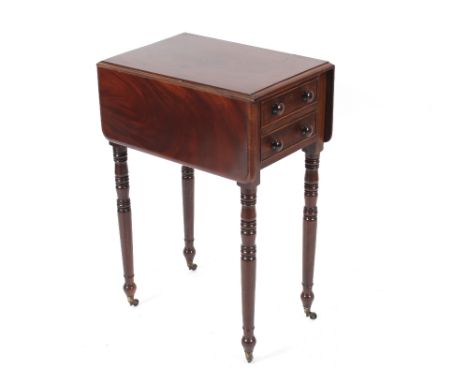 A 19th century mahogany drop leaf work table raised on ring turned tapering supports, 73cm wide