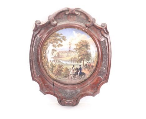 A pair of Prattware pot lids, depicting country houses contained in carved mahogany frames 