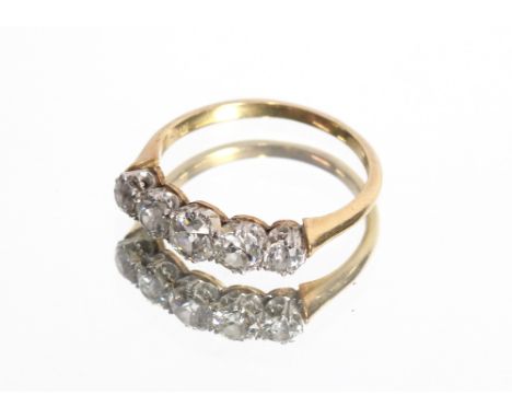 An 18ct gold, five stone diamond ring, centre stone approximately 0.25ct, 2.5gms total weight, ring size N