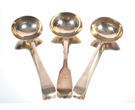 A William IV silver&nbsp;fiddle pattern sauce ladle by Charles Boyton and two Victorian silver old English pattern sauce ladl