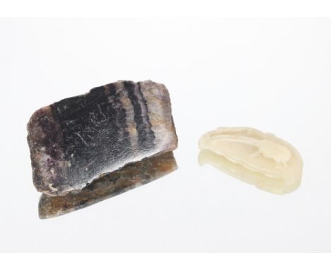 A small slab of Blue John, 8.5cm long and a white carved jade figure of an insect on a rock