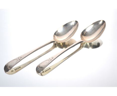 A pair of George III silver tablespoons with vacant cartouche surrounded by garlands.  London 1791 