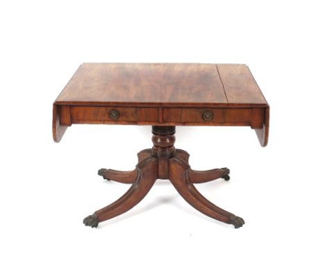 A 19th century mahogany sofa table, fitted with two short drawers raised on turned column and quatrefoil base, 91cm wide