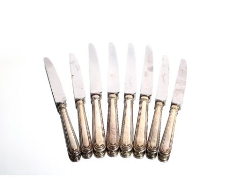 A set of twelve modern silver handled dinner knives and twelve matching tea knives