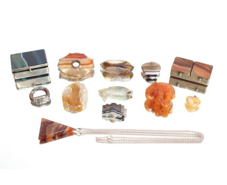 A collection of carved agate and other pendants, brooch, necklace, agate mounted stamp box and blue agate snuffbox, an amber 