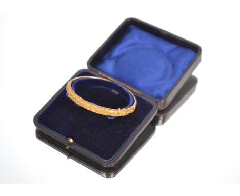 A 9ct gold filigree work decorated hinged bangle, approximately 8.5gms total weight