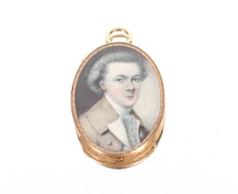 Early 19th century school portrait pendant depicting a young man in coat and white ruffled stock, contained in a yellow metal