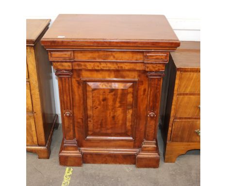 A 19th century mahogany pedestal cupboard fitted with shallow frieze drawer, the interior shelf enclosed by a moulded panel d