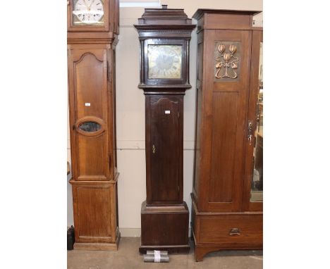 An oak longcase clock with stepped hood enclosing a brass and steel spandrel dial, inscribed J N O'Williamson, "In Leads Feci