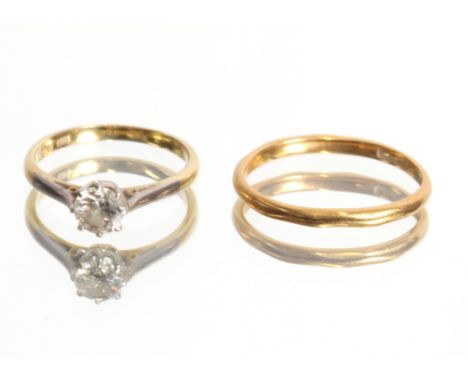 An 18ct gold solitaire, diamond ring, approximately ½ carat diamond, 2gms total weight, ring size J; and a 22ct gold wedding 