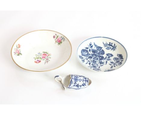 An unusual 18th century English porcelain feeding spoon of boat shape with leaf loop handle, 8.5cm long; a Worcester saucer d