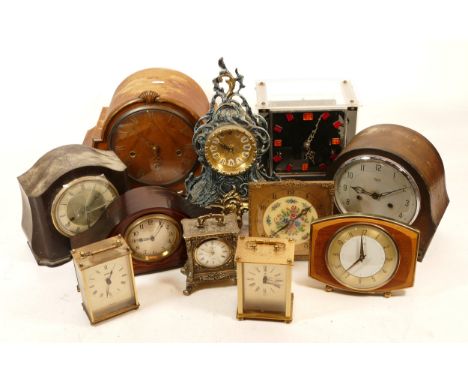 A collection of mid 20th century and later mantel clocks, having manual wind and quartz movements, in two boxes. (2)