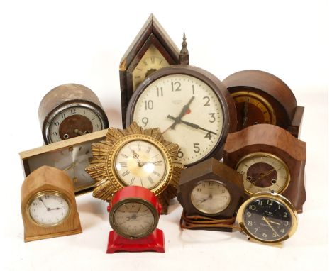 A collection of mid 20th century and later mantel clocks, having manual wind and quartz movements, in two boxes. (2)
