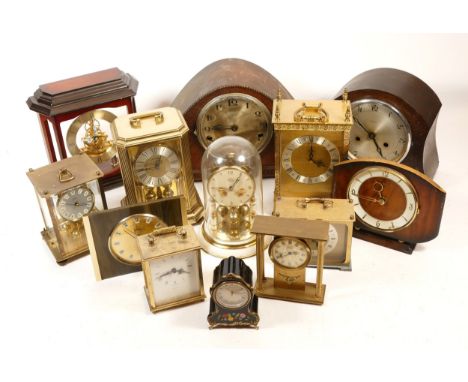 A collection of mid 20th century and later mantel clocks, having manual wind and quartz movements, in two boxes. (2)