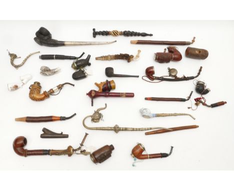A collection of early 20th century and later oriental carved opium and meerschaum pipes, including an oriental ceramic bowl e