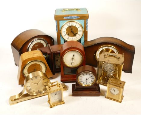 A collection of mid 20th century and later mantel clocks, having manual wind and quartz movements, in two boxes. (2)